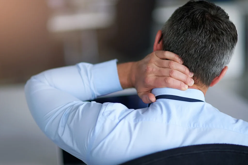 man massaging neck in office setting 2026 03 25 03 57 46 utc