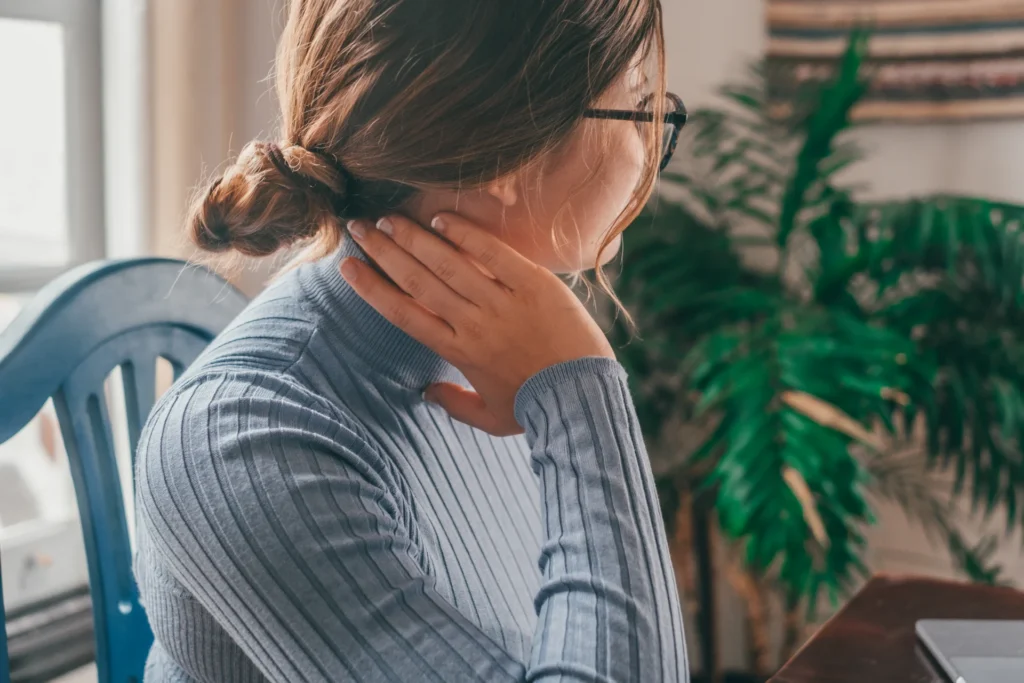 woman relaxing at home with hand on neck 2026 03 24 11 22 38 utc